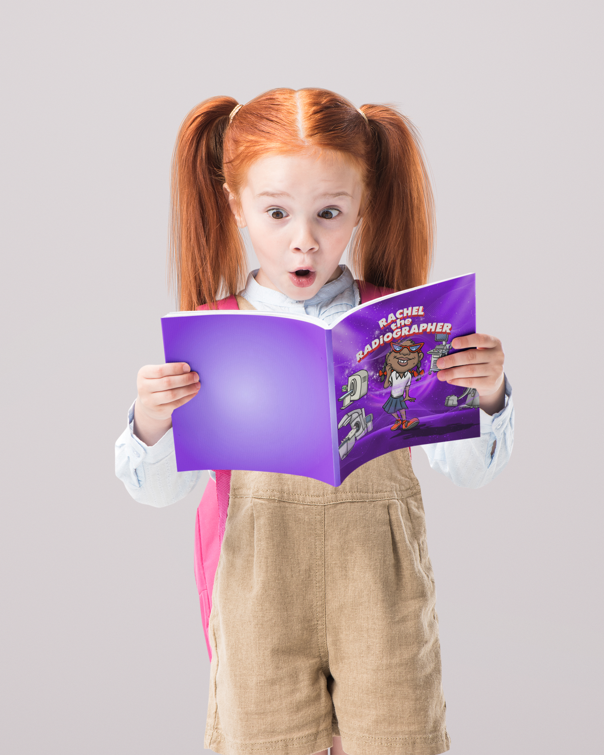 redhead little girl surprised face reading childrens book rachel the radiographer
